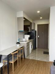 Modern small kitchen area with dining space