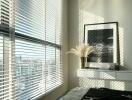 Modern bedroom with large windows and blinds