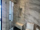 Modern bathroom with glass shower and white toilet