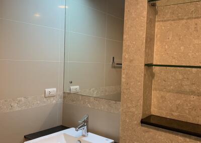 Bathroom with sink and shelves