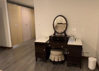 Bedroom with vanity and closet