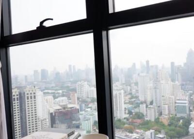 High-rise living room with large window and city view