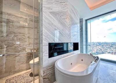 Luxurious bathroom with marble tiles and a view