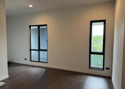 Minimalist living room with large windows