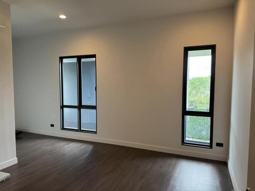 Minimalist living room with large windows