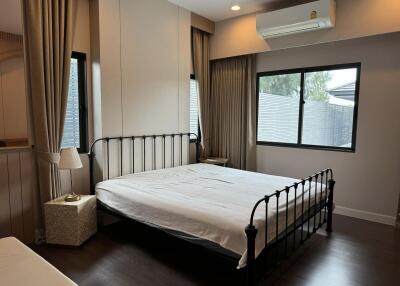 Spacious bedroom with large windows and ample natural light