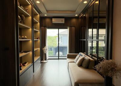 Modern living room with built-in shelves and large window