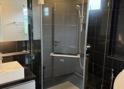 Modern bathroom with glass shower and white fixtures