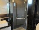 Modern bathroom with glass shower and white fixtures