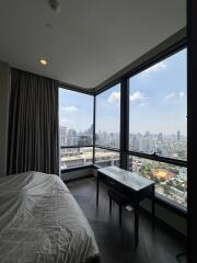 Bedroom with a view of the city skyline