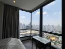 Bedroom with a view of the city skyline