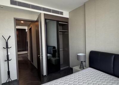 Modern bedroom with bed and built-in wardrobe