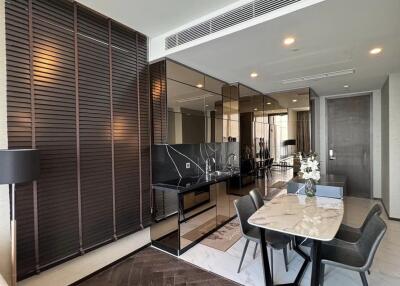 Modern living and dining room with mirror wall