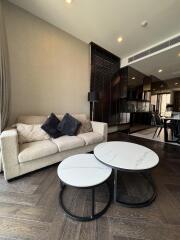 Modern living room with sofa and nested coffee tables