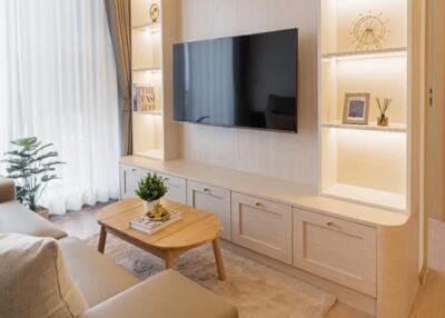 modern living room with wall-mounted TV and built-in shelves