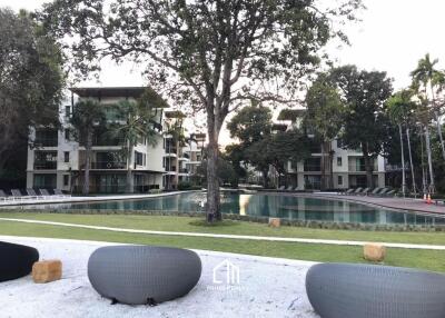 Outdoor area with pool and apartments