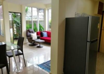 Spacious living room and dining area with large windows