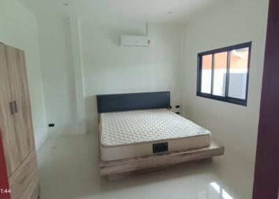 Modern bedroom with air conditioning and natural light