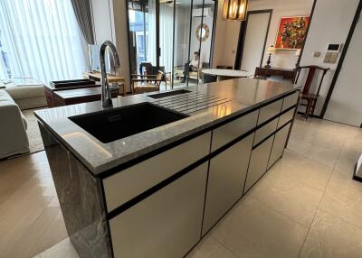 Modern kitchen with island and adjacent living area