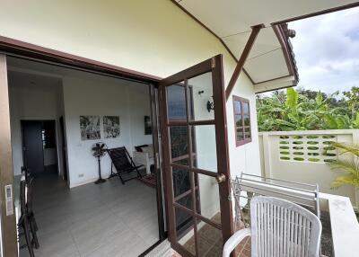 Balcony view with open door leading to living space