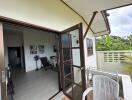 Balcony view with open door leading to living space