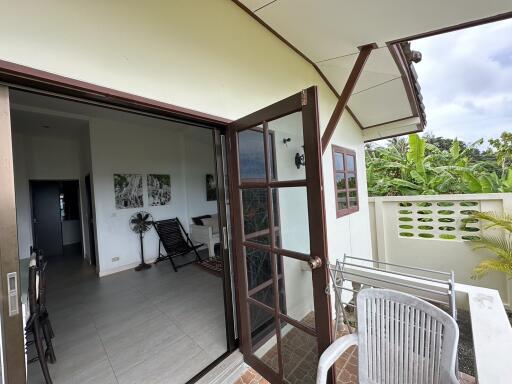 Balcony view with open door leading to living space