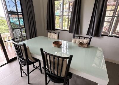 Dining table with chairs in a well-lit room