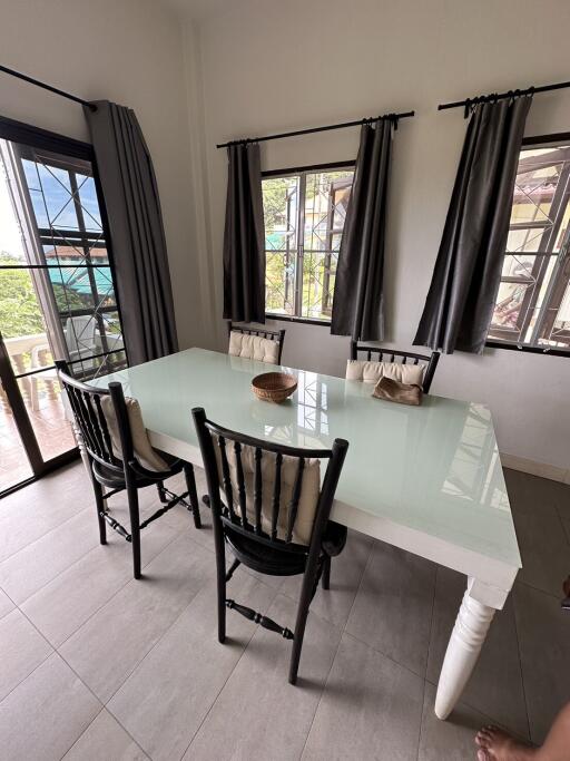 Dining table with chairs in a well-lit room