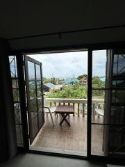 Balcony view with table and chairs