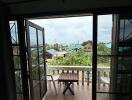 Balcony view with table and chairs