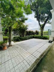 Spacious outdoor patio with greenery