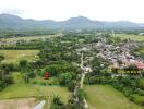 Aerial view of the property and surrounding area with a marked plot