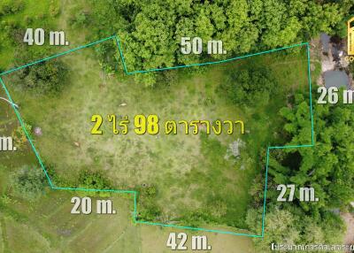 Aerial view of a land plot with marked boundaries and measurements.