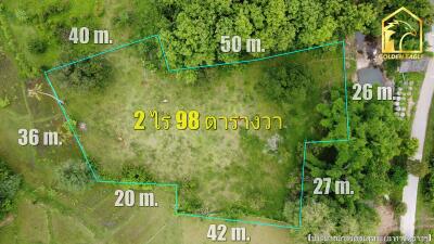 Aerial view of a land plot with marked boundaries and measurements.