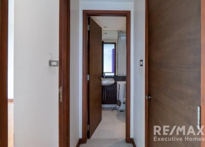 Interior view of a hallway leading to a bathroom