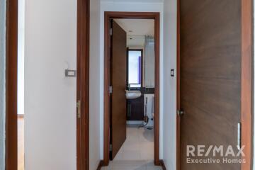 Interior view of a hallway leading to a bathroom