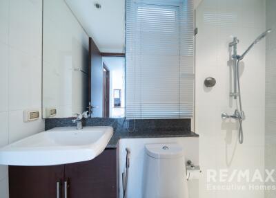 Modern bathroom with shower and vanity for property listing