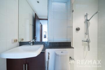 Modern bathroom with shower and vanity for property listing