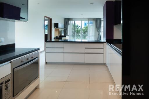 Modern kitchen with white cabinets and appliances