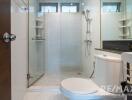 Modern bathroom with glass shower and toilet