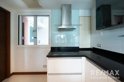 Modern kitchen with window and built-in appliances