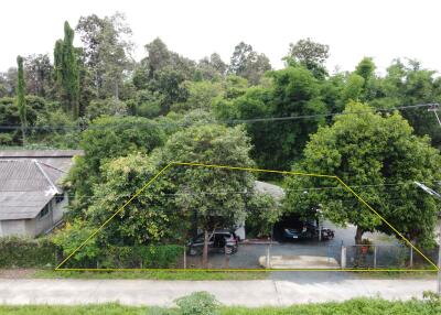 Exterior view of property with trees and building