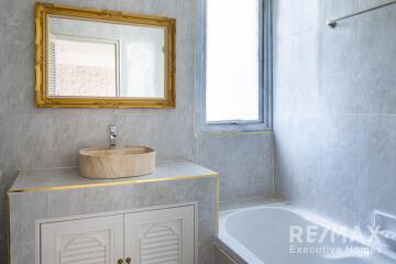 Modern bathroom with sink and bathtub