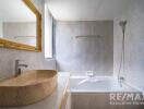 Modern bathroom with a marble sink, bathtub, wall-mounted shower, and large window