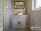 Bathroom with a sink, mirror, and window