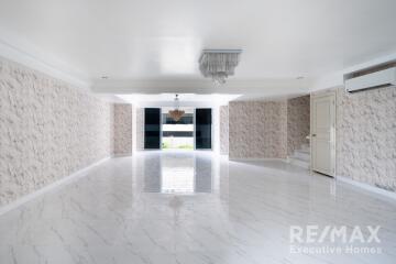 Spacious and well-lit living room with modern interior