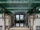 Modern building entrance with green pergola