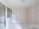 Empty bedroom with marble-textured walls