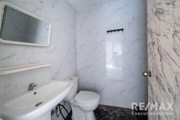 Modern and clean bathroom with white marble tiles