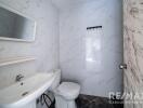 Modern and clean bathroom with white marble tiles